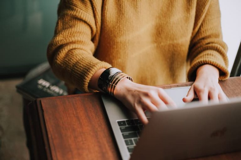 a woman working on her laptop Feature Image For: Recruitment Automation – It’s about time!