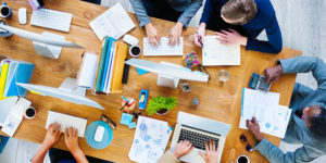Business people having a corporate meeting in one brown table