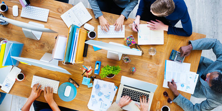 Business people having a corporate meeting in one brown table