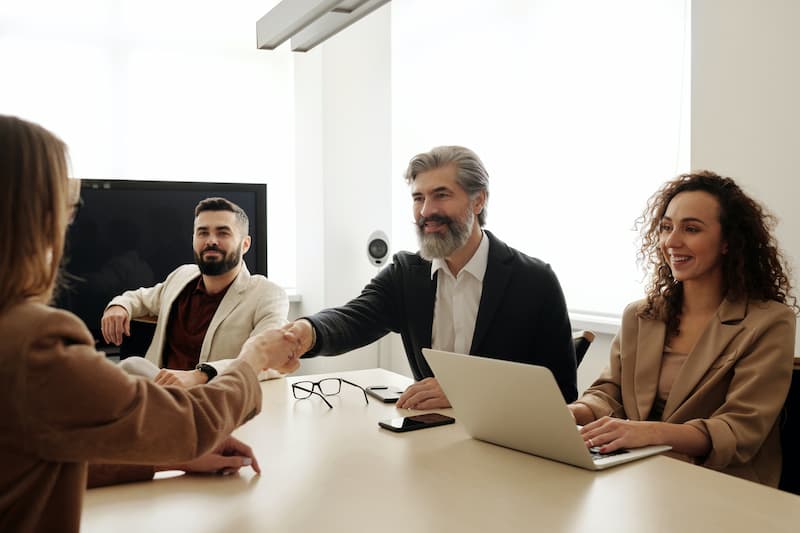 people sitting on a table having an interview