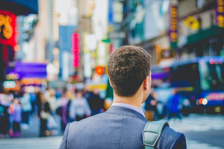 a person in the street going to a job Feature Image for: How to Rebuild Your Recruitment Strategy after COVID-19