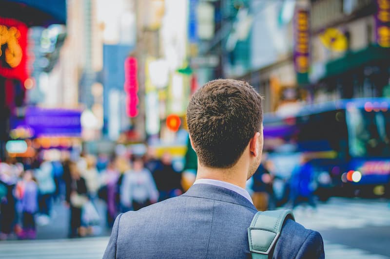 a person in the street going to a job Feature Image for: How to Rebuild Your Recruitment Strategy after COVID-19