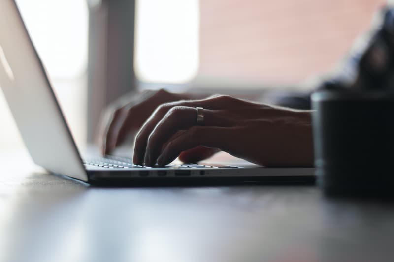 a man on his laptop typing Feature Image For: 15 Best Employment Portals for Posting Part-Time Jobs