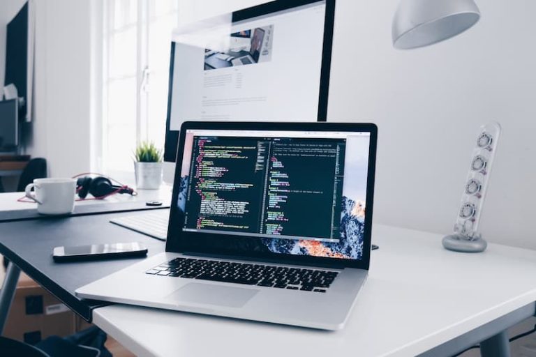 an open laptop on a desk with codes on the screen Feature Image For: 18 Best Tech Job Boards for Employers in Singapore